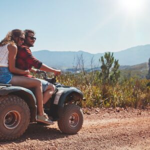 Couple in nature on a quad bike
